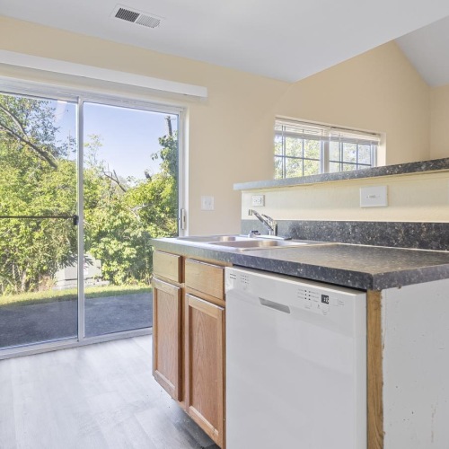 a kitchen with a large window