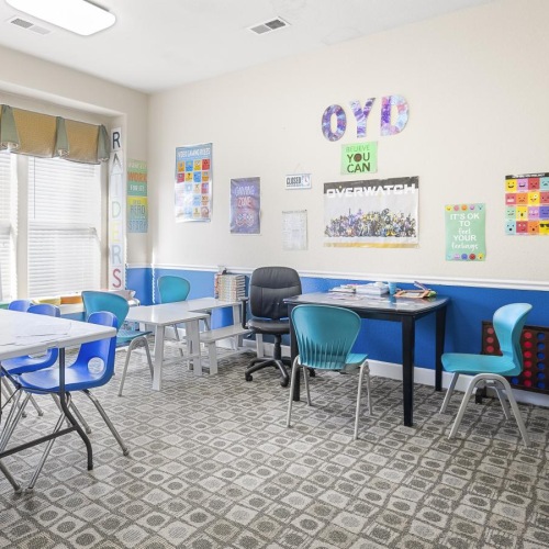 a room with tables and chairs